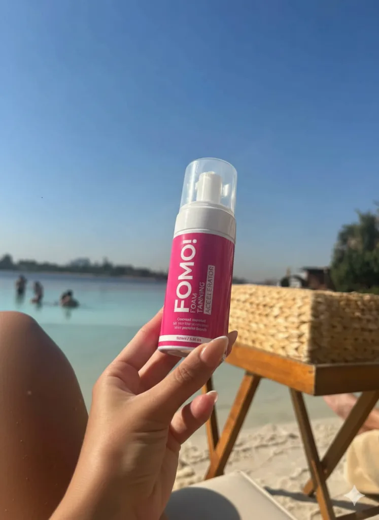 Tanning accelerator foam being held in sunlight before tanning to support faster deeper and more even results